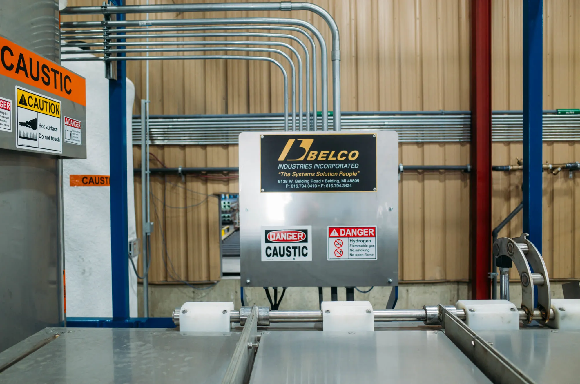 A Belco automatic die cleaning tank installed on the plant floor.